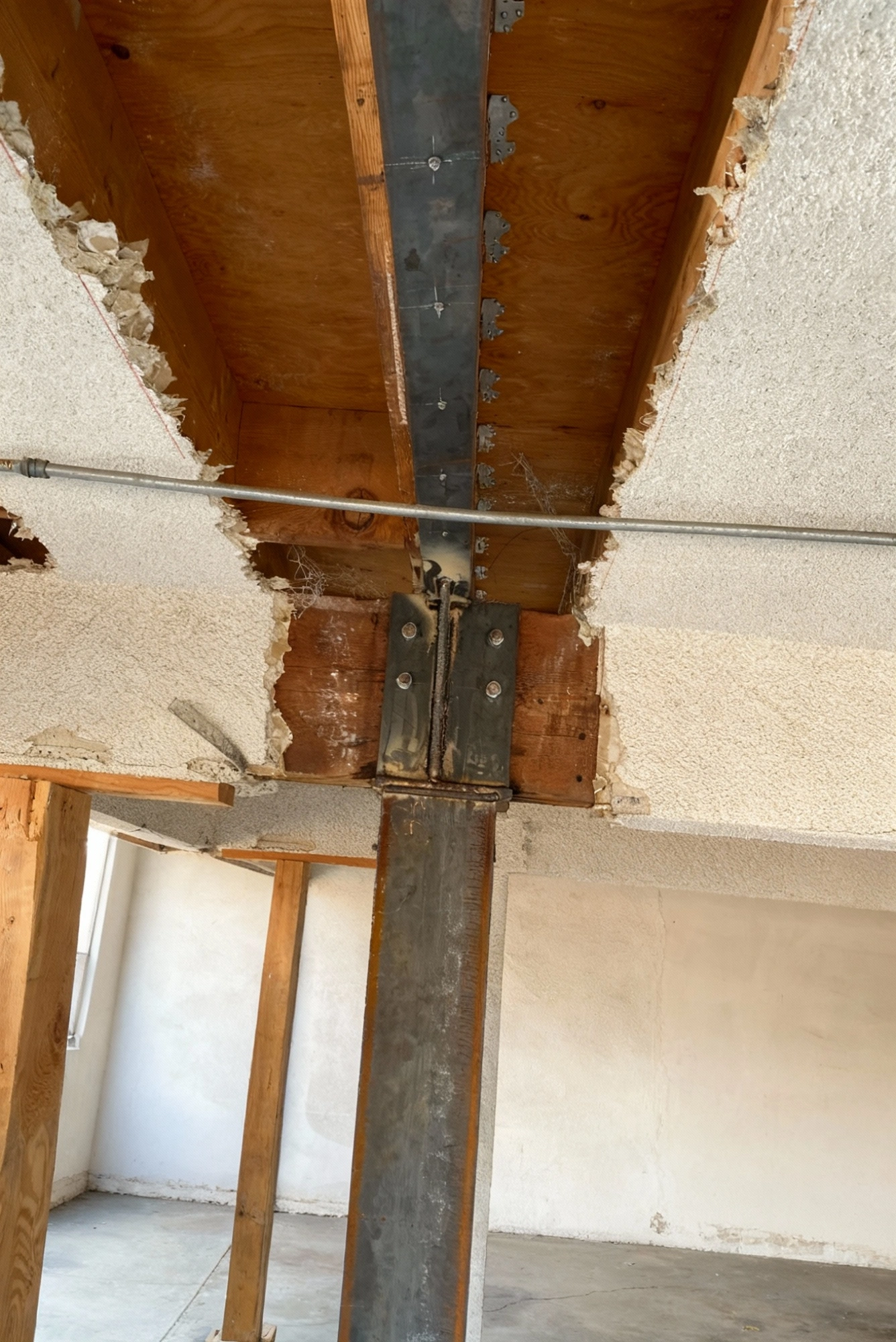 Retrofitting team reinforcing weak foundation areas to improve seismic safety in Los Angeles