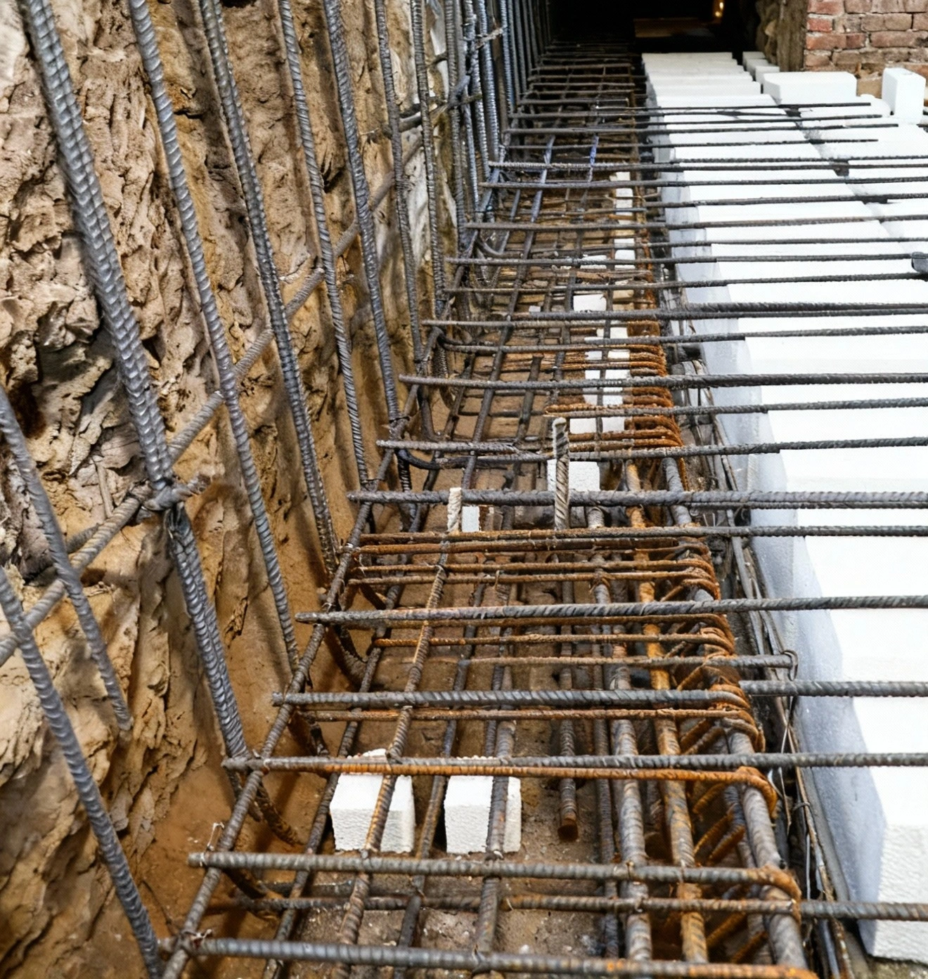 site inspector using a surveying tripod to assess ground levels in Los Angeles